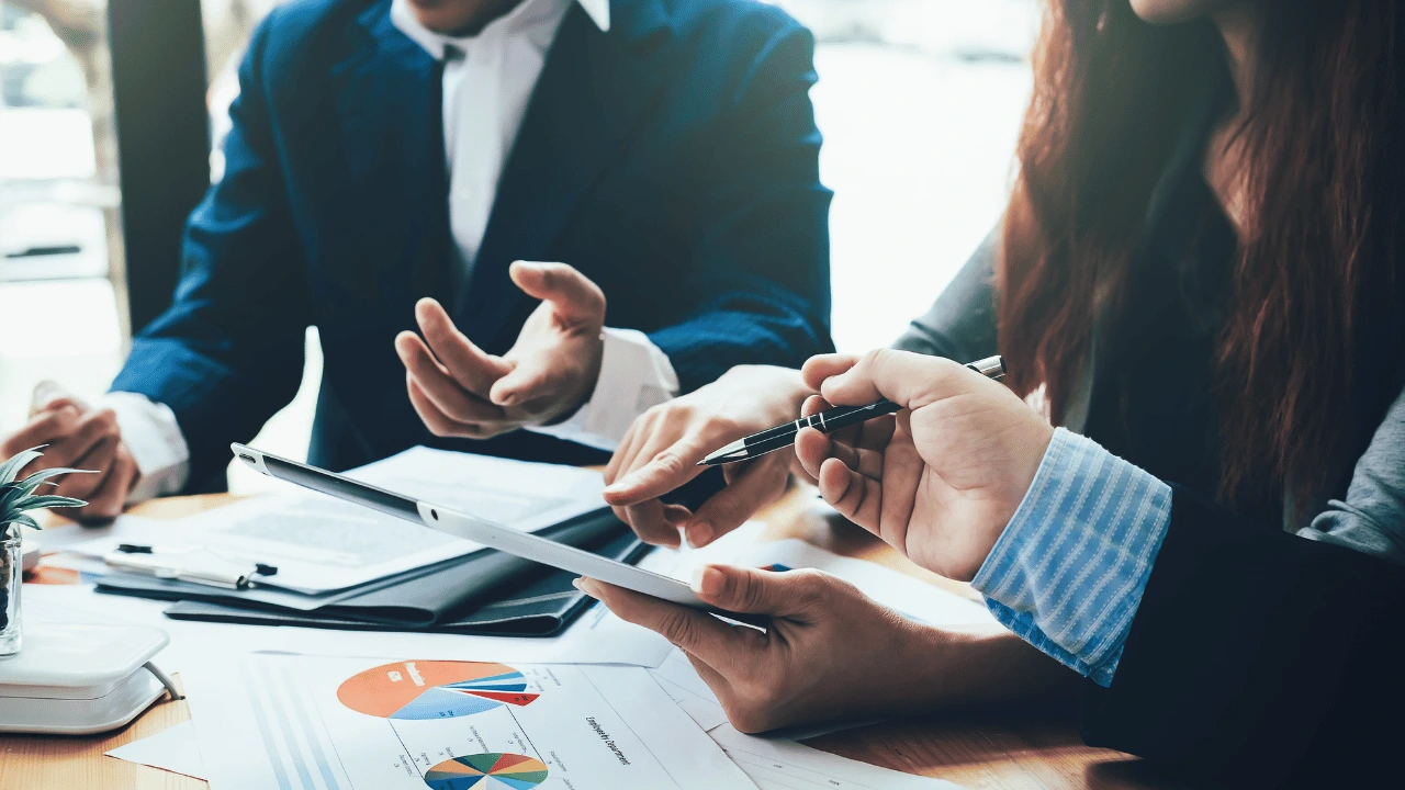 Construction team reviewing subcontractor performance on affordable housing project